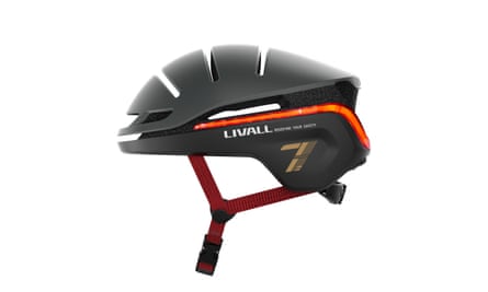 A black LIVALL EVO21 bike helmet with a red strip light and a dark red strap