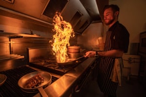 Chef at the Biloela Hotel prepares bacon and glazed pork ribs and chips in the hotel kitchen. The fats and oils used at the Biloela Hotel will be collected and end up back at Bettafield and used to produce biogas.