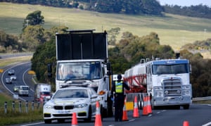 Gisborne, Australia. Victoria police check drivers’ licences on the outbound section of the Calder highway, near Gisborne, as part of the lockdown measures introduced during Operation Sentinel