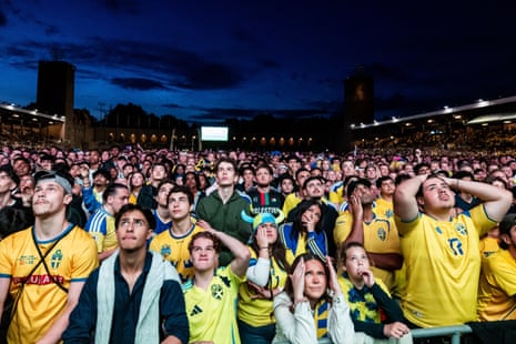 Swedish fans watch the big screen at Stockholm Stadion