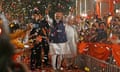 India's prime minister Narendra Modi shows the victory sign as he arrives at his party's headquarters