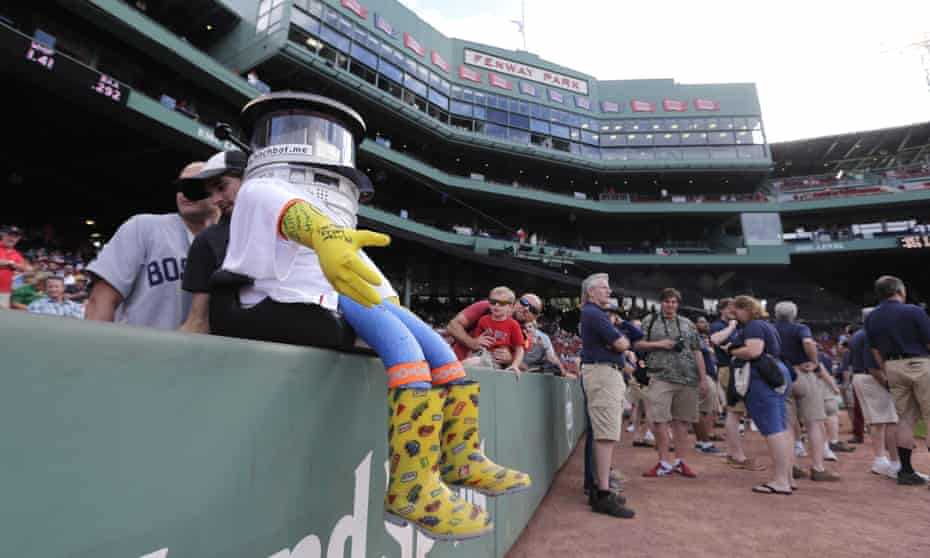 Hitchbot takes in pre-game activity in Boston’s Fenway Park.