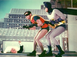 Adam West as the Caped Crusader and Burt Ward as Robin - The Boy Wonder perform a death defying stunt