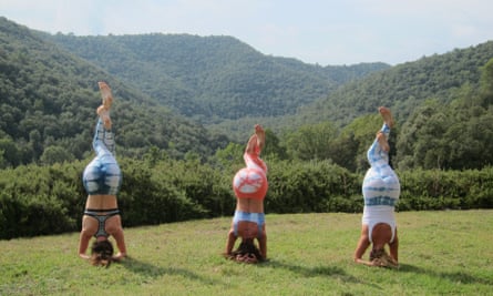 Three women practising a yoga position at Chaya Yoga Retreats Ibiza