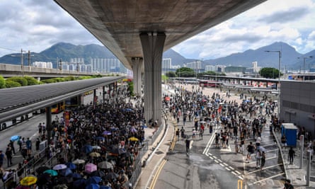 Protesters gather in the airport bus terminal