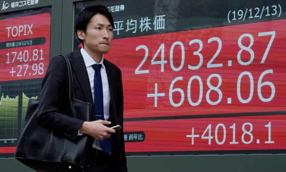 Pedestrian in front of Nikkei Stock Average