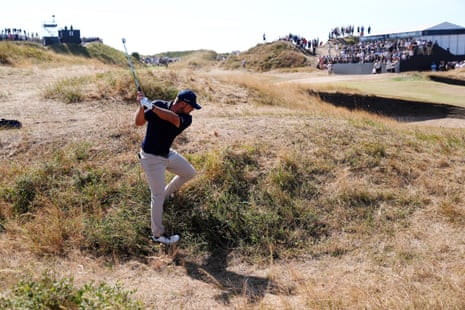 Bryson DeChambeau of the USA plays from the rough on the 11th