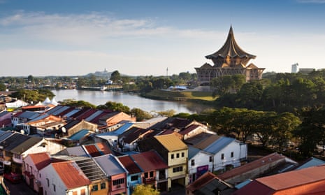 view over Chinatown and the Sarawak river to the State Assembly Building.