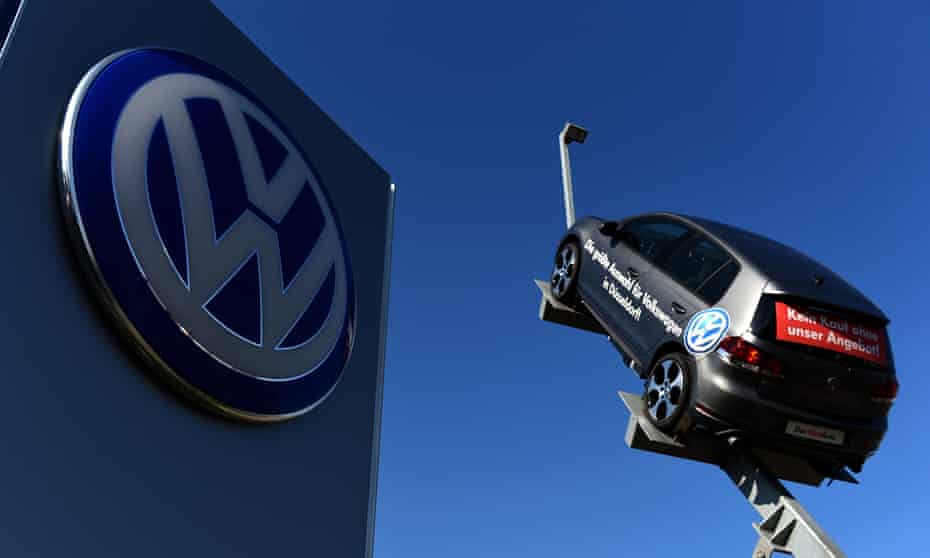 A VW car and logo at the entrance to a VW branch in Duesseldorf