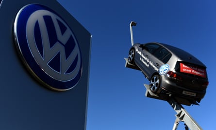 A model and logo of German car maker Volkswagen (VW) at the entrance to a branch in Düsseldorf, western Germany.