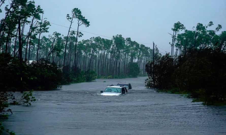Cars sit submerged in water from Hurricane Dorian in Freeport, the Bahamas