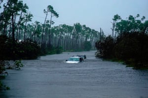 Cars sit submerged in water from Hurricane Dorian in Freeport, Bahamas, on Tuesday
