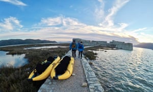 The writer, right, prepares to go kayaking.