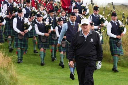 Trump followed by a bagpiper band