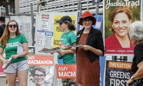 Green’s candidate Amy MacMahon hands out how-to-vote cards for the seat of South Brisbane on Saturday.