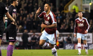 Andre Gray celebrates completing his hat trick against Bristol City.