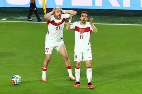 Turkey's Baris Alper Yilmaz and Yunus Akgun react.
