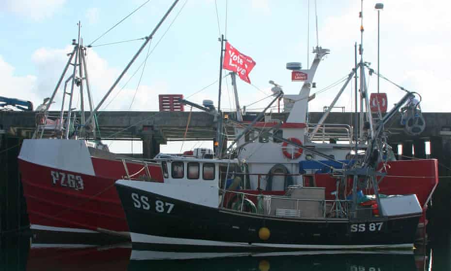 Fishing boats with Vote Leave flags in Newlyn harbour