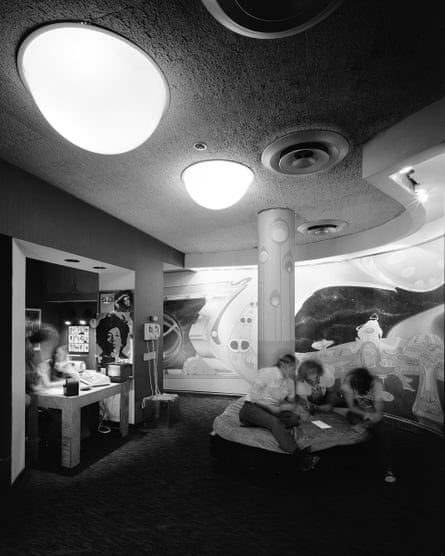 black and white photo of a studio space with curved walls