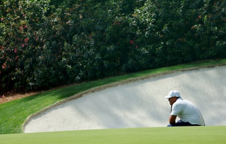 Brooks Koepka studies his putt on the 13th.