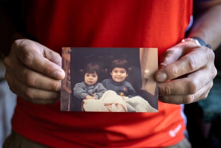 Adopted Chilean babies Emily and Sean as children, in a photo held by him