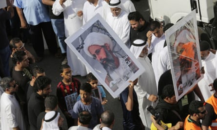 Saudis carry a poster demanding freedom for Nimr during a funeral procession in May last year.