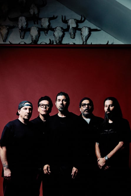 Deftones, on a dark red background.