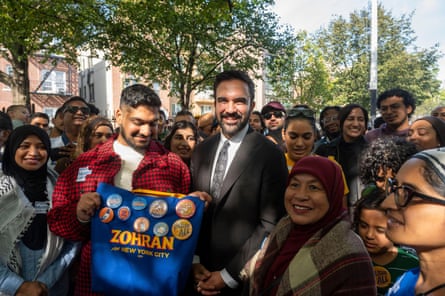 Zohran Mamdani poses with volunteers at a canvass in Astoria organized by the Muslim Democratic Club of New York at Sean’s Place Park on October 19, 2025 in the Queens borough of New York City.
