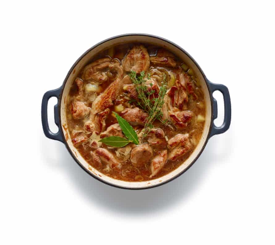 ... then return the meat to the pan along with the herbs, cover and cook for an hour.