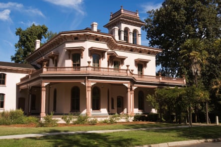 A stately looking beige Victorian-style manor.