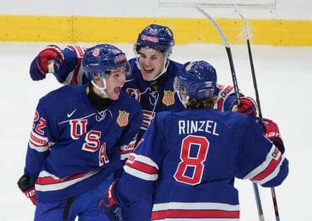 The United States' Isaac Howard (22) celebrates with teammates after scoring his second goal of the game during the second period on Friday.