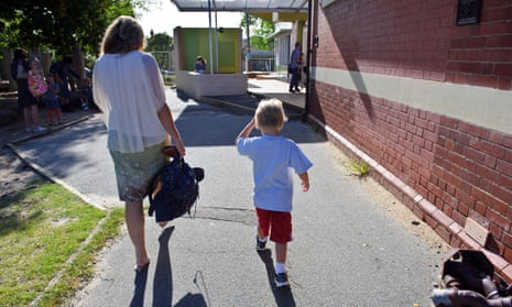 Mother and son walking to school
