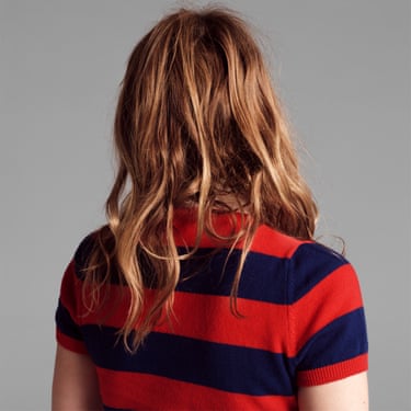 Drew Barrymore’s hair and shoulders in a stripey top seen from behind