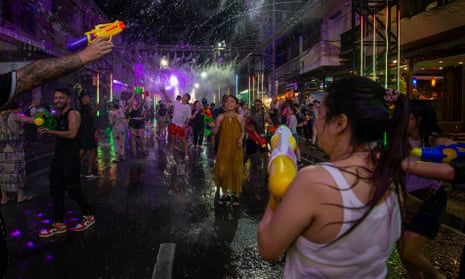 Tourists take part in a water gun battle during Songkran celebrations in Thailand.