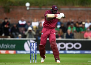 Jason Holder plays a shot.