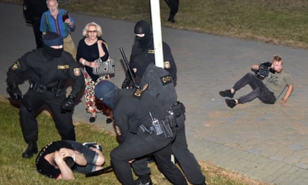 Riot police detain a demonstrator in Minsk on Sunday.