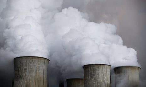 Steam rises from the cooling towers of the coal power plant of RWE in Niederaussem, Germany.