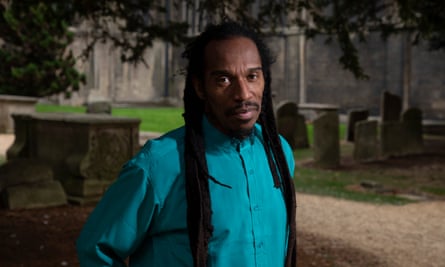 Benjamin Zephaniah poses for a portrait in a churchyard