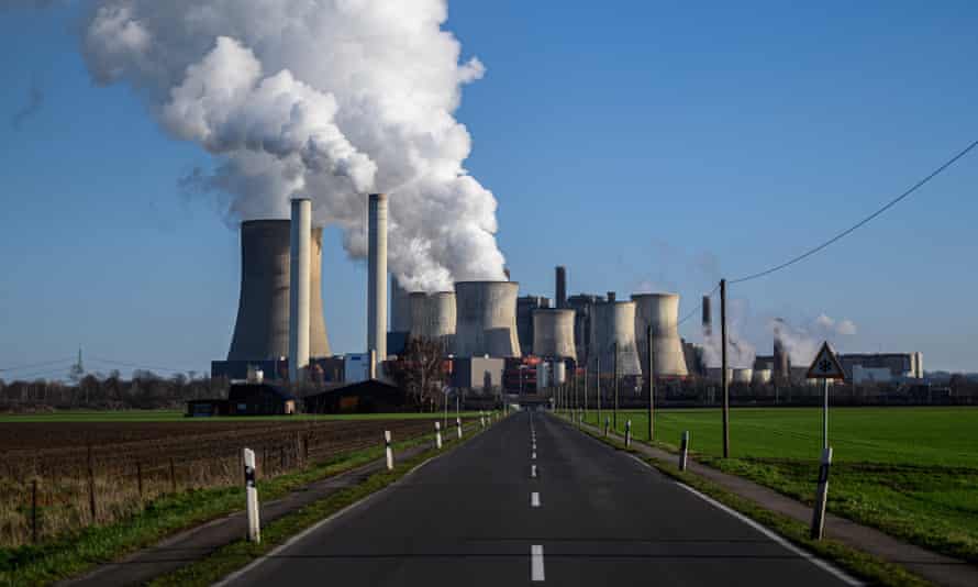 Steam rises from cooling towers at the Niederaussem coal-fired power plant near Bergheim, Germany