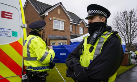Police stand guard outside the home of Peter Murrell and Nicola Sturgeon in Glasgow, after Murrell was arrested in connection with an investigation into SNP funding and finances.