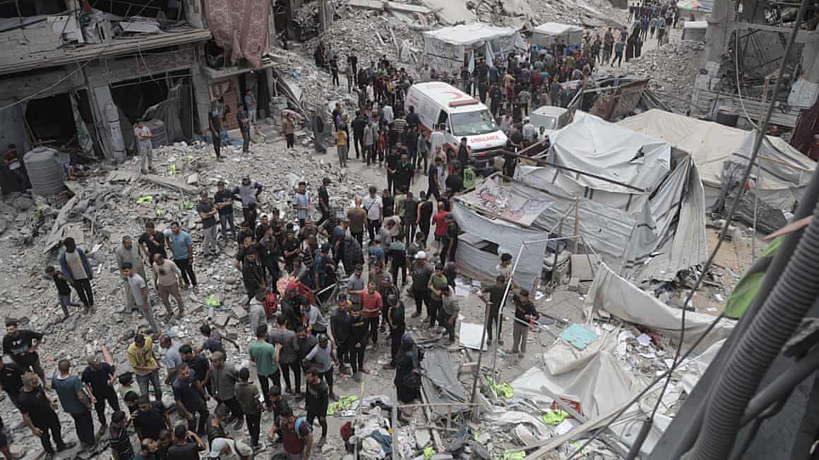 People looking at destroyed building