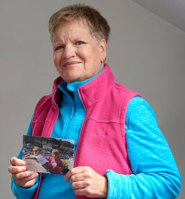 Sheelagh Stewart holding a photograph of her children