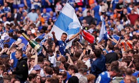 Ipswich Town players and fans celebrate promotion to the Premier League.