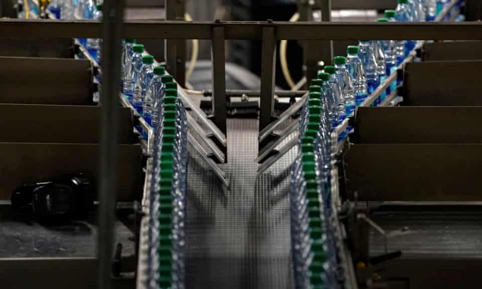 Bottles of Coca-Cola’s Dasani brand water move along the production line.