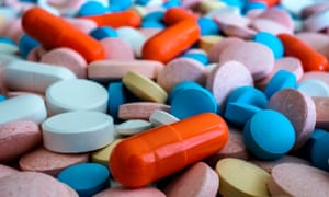 an array of colourful pills pictured close-up