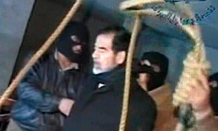 Television footage shows masked executioners prepare to execute former Iraqi president Saddam Hussein.