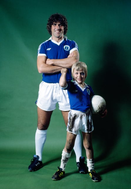 EvertonâÂÂs Bob Latchford poses with a young boy wearing replica kit during an Umbro advertising photo shoot before the 1978-79 season.