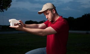 Cody Wilson poses with a ‘Liberator’ 3D-printed gun.