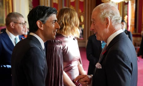 King Charles speaking with Rishi Sunak during a reception at Buckingham Palace before the Cop27 summit
