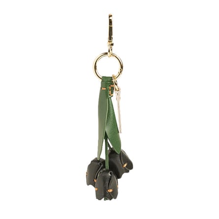 Gold colour keyring with three leather black tulips hanging from it